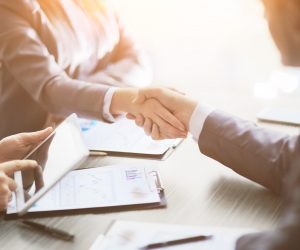 Business people shaking hands, finishing up a meeting